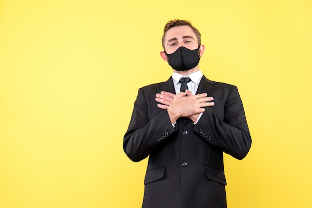 Portrait of confident businessman on yellow