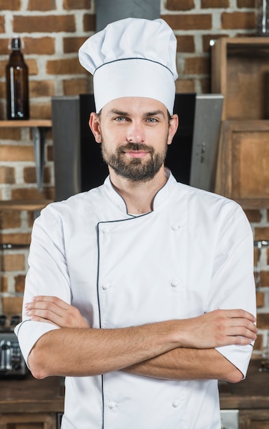 Portrait of confident male chef in the kitchen