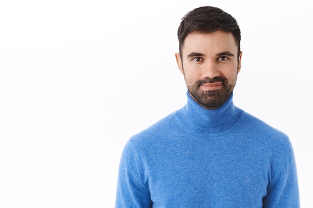 Portrait of confident, professional bearded male manager, boss or employee smiling pleased, feel successful and self-assured, assertive, standing ready white wall