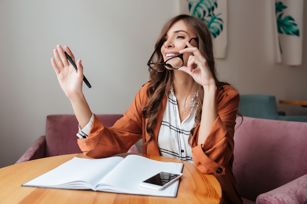 Free Photo portrait of a confident woman taking notes