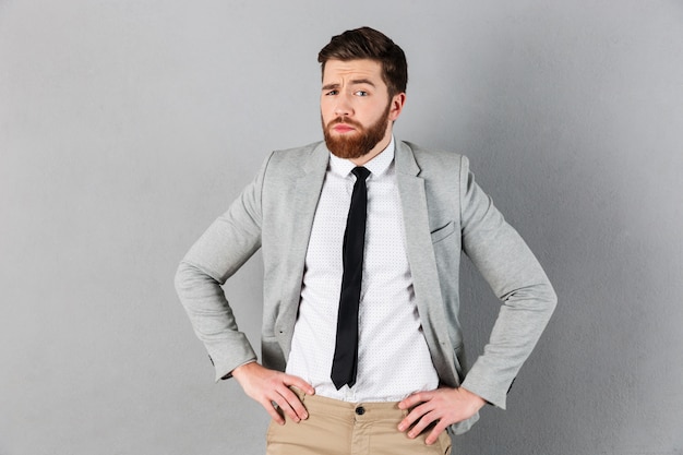 Portrait of a confused businessman dressed in suit