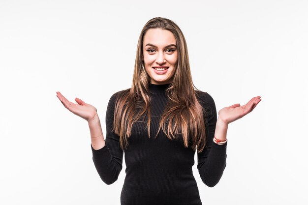 Portrait of a confused girl in a dark dress Isolated over white.