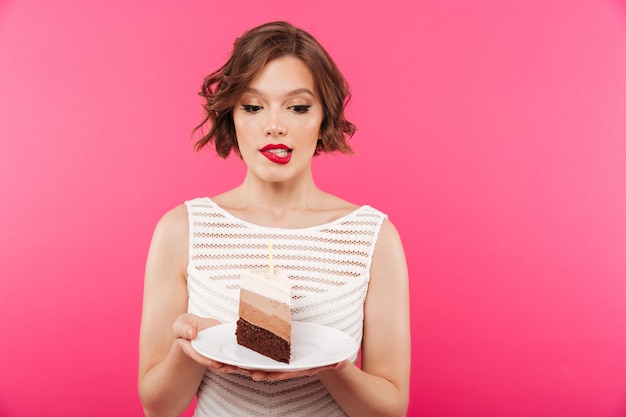 Portrait of a confused girl holding plate