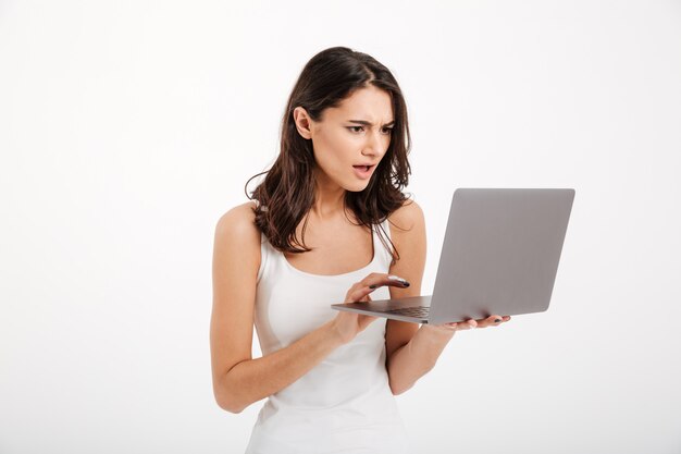 Portrait of a confused woman dressed in tank-top