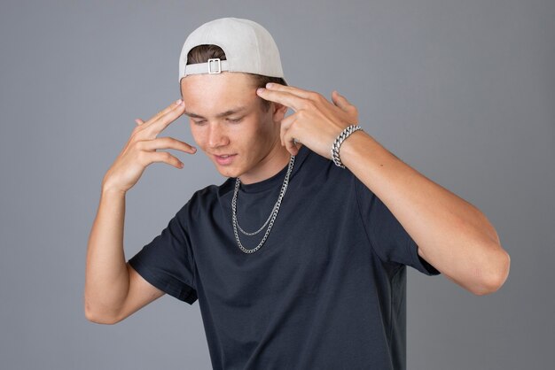 Portrait of cool teenage boy wearing a cap