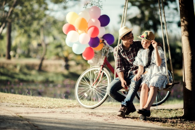 Portrait of a couple in love with balloons colorful