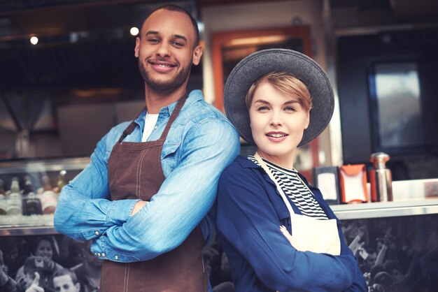 Portrait of couple selling food on the street