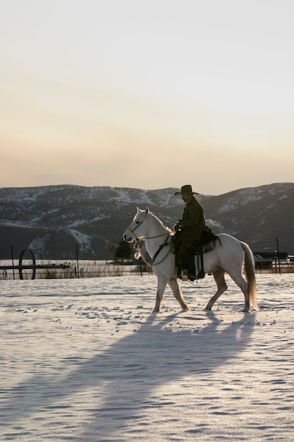 Free photo portrait of cowboy on a horse