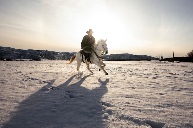 Free photo portrait of cowboy on a horse