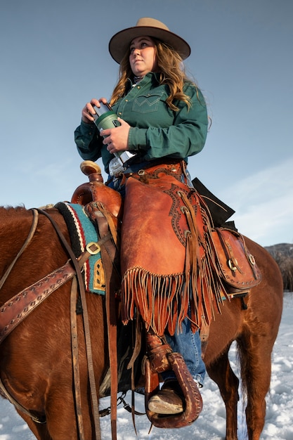 Portrait of cowgirl on a horse