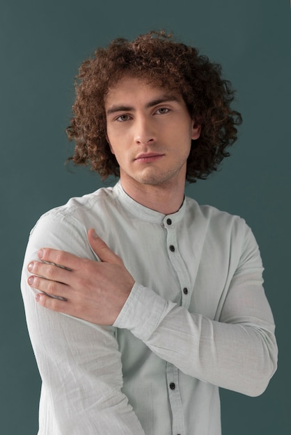 Free photo portrait curly haired young man