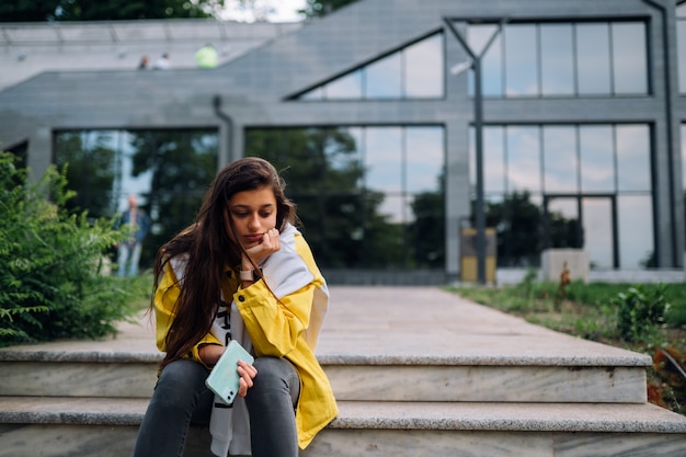 Portrait of cute beautiful young woman having fun and posing outdoors.