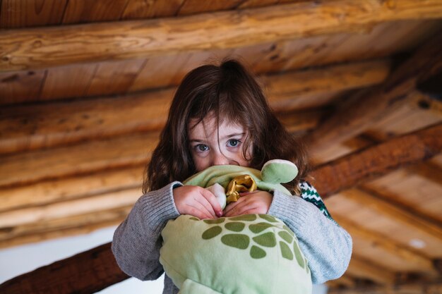 Portrait of a cute girl with soft toy