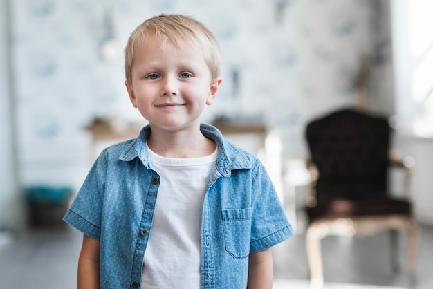 Free photo portrait of a cute smiling blonde boy