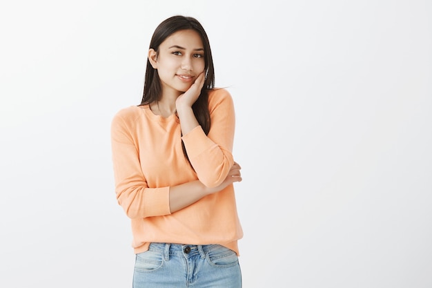 Portrait of cute tanned brunette in casual clothes