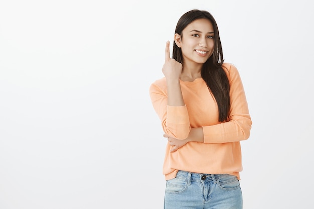 Portrait of cute tanned brunette in casual clothes