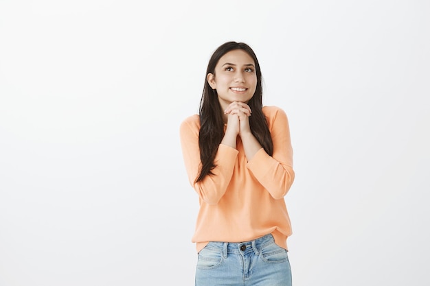 Portrait of cute tanned brunette in casual clothes