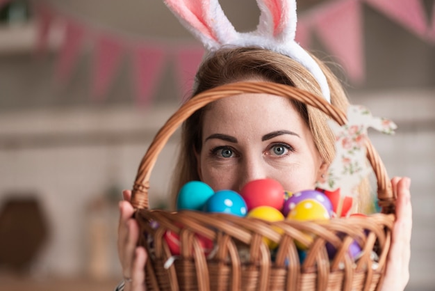 Portrait of cute woman with bunny ears