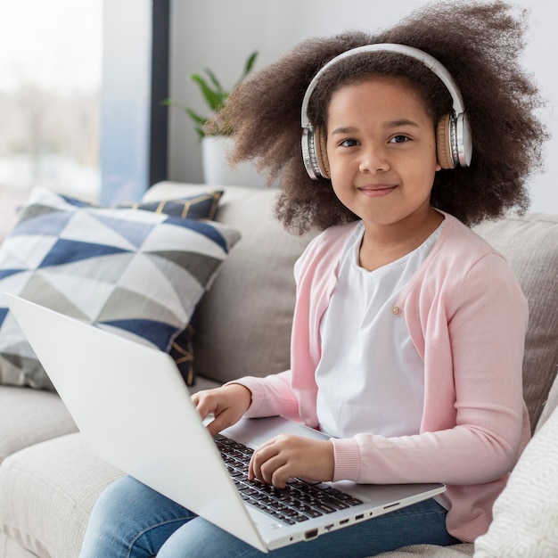 Portrait of cute young girl with curly hair