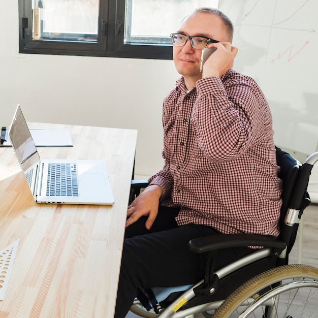 Portrait of disabled male working at the office