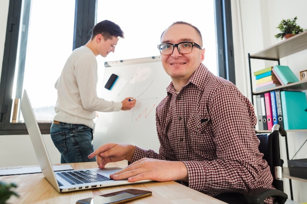 Portrait of disabled man working at the office