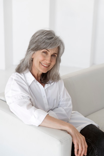 Portrait of elegant older woman posing and being happy