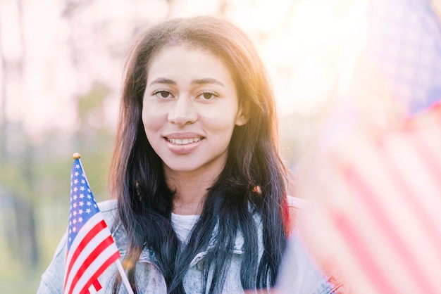 Portrait of ethnic American woman in sunshine