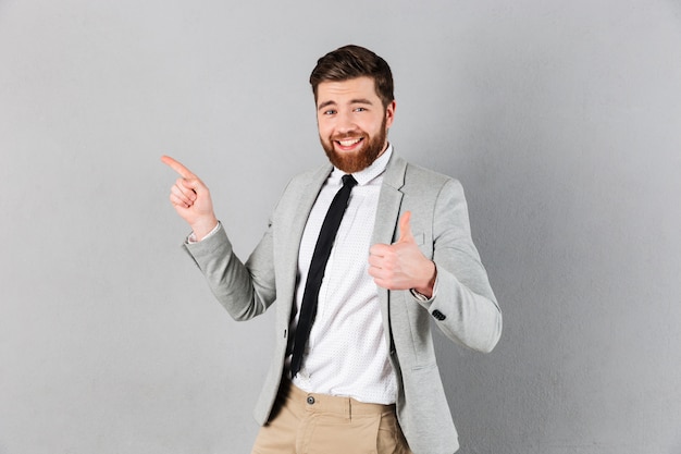 Portrait of an excited businessman dressed in suit