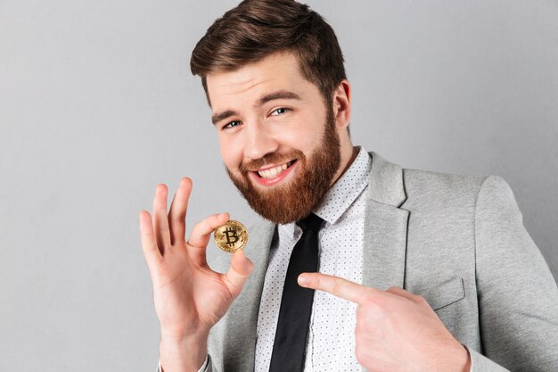 Portrait of an excited businessman dressed in suit