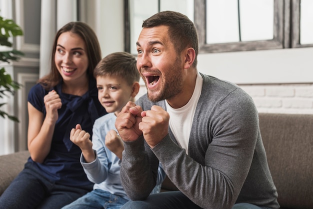 Portrait of excited family with son