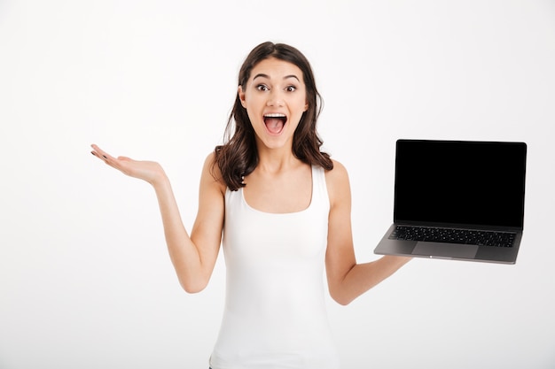 Portrait of an excited woman dressed in tank-top