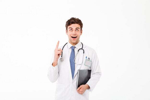 Portrait of an excited young male doctor