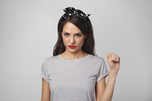 Portrait of an expressive woman posing in the studio