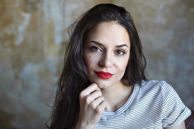 Portrait of an expressive woman posing in the studio