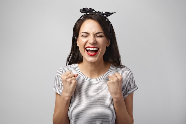 Portrait of an expressive woman posing in the studio