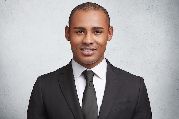 Portrait of expressive young man wearing formal suit