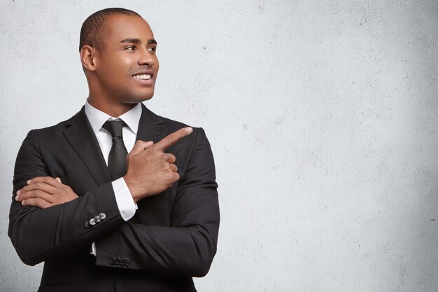 Portrait of expressive young man wearing formal suit