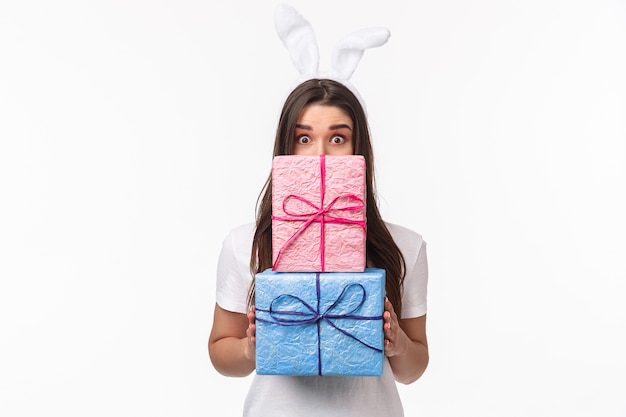 portrait expressive young woman holding gifts