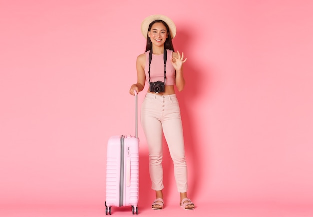 Portrait expressive young woman with suitcase