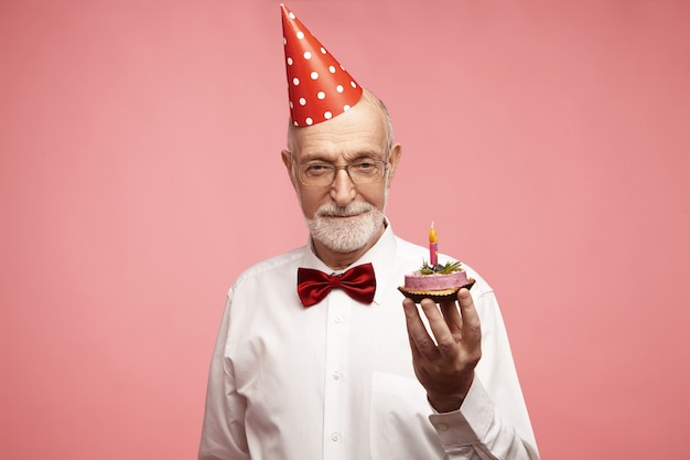 Free photo portrait of fashionable elegant mature sixty year old bearded european male wearing red bow tie