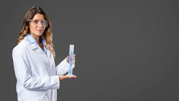 Portrait female doctor using hand sanitizer