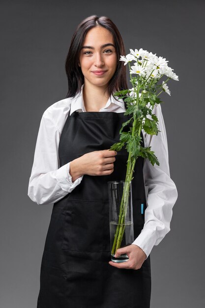 Portrait female florist with flowers