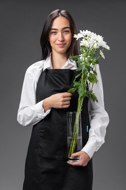 Portrait female florist with flowers