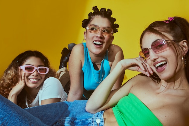 Portrait of female friends in 2000s fashion style posing together