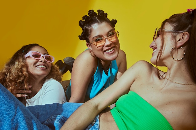 Portrait of female friends in 2000s fashion style posing together