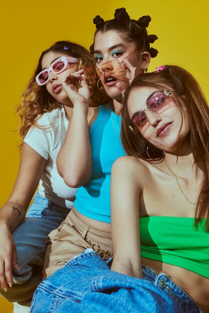 Portrait of female friends in 2000s fashion style posing together