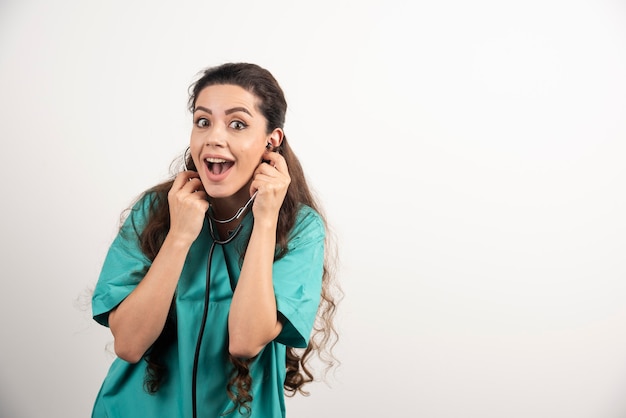 Portrait of female healthcare worker posing with stethoscope.