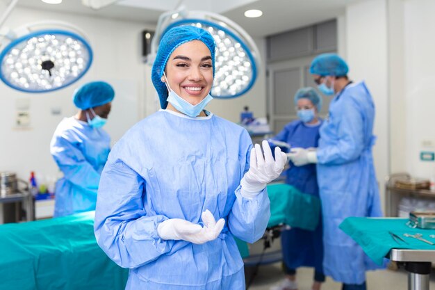 Portrait of female woman nurse surgeon OR staff member dressed in surgical scrubs gown mask and hair net in hospital operating room theater