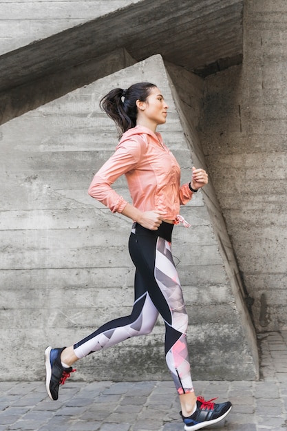 Portrait of fit woman jogging outdoor