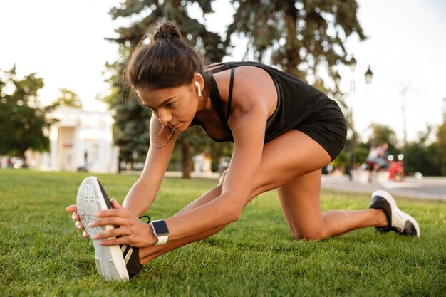 Portrait of a fitness woman in earphones